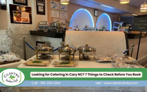 Catering setup at Cilantro Indian Cafe in Cary, NC, featuring covered stainless-steel serving dishes and prepared food trays, with a promotional banner reading Looking for Catering in Cary NC? 7 Things to Check Before You Book.