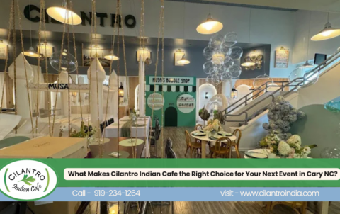 Cilantro Indian Cafe in Cary, NC, featuring a colorful, elegant interior with decorative seating, floral arrangements, hanging lights, and a staircase, with a banner promoting event hosting.