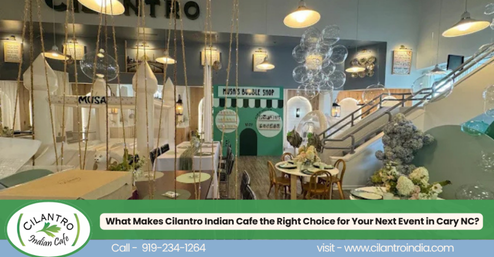 Cilantro Indian Cafe in Cary, NC, featuring a colorful, elegant interior with decorative seating, floral arrangements, hanging lights, and a staircase, with a banner promoting event hosting.